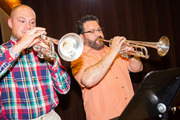 M-CATs band members Austin Moore and Rudy Rodriguez entertain the room with their performance.