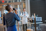 A UTSW physician takes notice of Ms. Anderson’s performance as he enters the hospital.