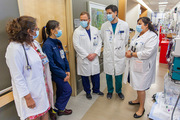 Physicians discuss medical cases in a hospital ward designated for COVID-19 patients.