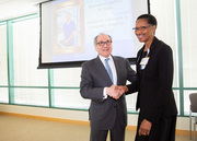 Dr. Daniel K. Podolsky shakes hands with 45-year service honoree Bernadine “Bernie” Wafford.