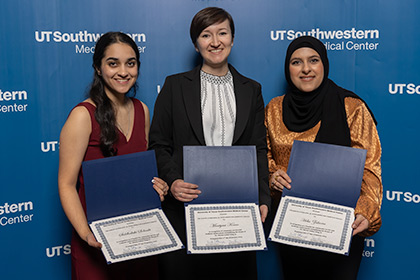 blue background, three women with certificates