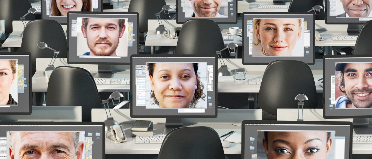 Rows of computer screens with faces on them