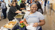 Tatyana Johnson, a Certified Medical Office Assistant, is ready to enjoy the cuisine.