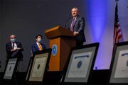 Dr. John Warner, Executive Vice President for Health System Affairs, presents awards in the categories of Patient and Family Recognition and Program Development.