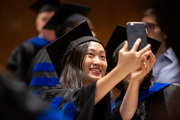 Dr. Yi-Li Min captures the perfect selfie on graduation day.