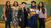 Jeethu Joseph, Ph.D., celebrates the occasion with her family and mentor Tracy Greer, Ph.D., Adjunct Associate Professor of Psychiatry.