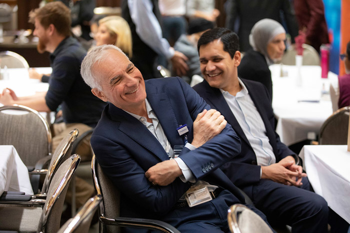 Two people smiling and laughing