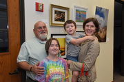 Kristen Holland Shear and family with their photo, Accidental Renaissance