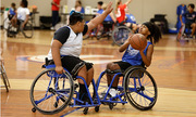 A player makes a block during wheelchair basketball.