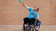 A participant throws a good shot in adaptive discus.