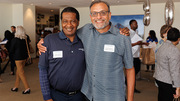 Quarter Century Club member Chester Smith (left) congratulates 30-year honoree Ivan Yuhanna.