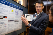 Medical student Feng Gao explains the results of his research project about developing an intraoperative tool to monitor spinal cord hemodynamics.