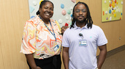 Verna Williams (left) in the Office of Institutional Equity and Access, and Quincy Washington, a Health Information Management Senior Specialist, pose for a photo.