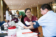 Blood pressure screening at the Heart Month health fair on South Campus.