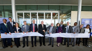 UT Dallas President Richard C. Benson and UT Southwestern President Daniel K. Podolsky, M.D., (center left and right), cut the ribbon at the dedication ceremony opening the Texas Instruments Biomedical Engineering and Sciences Building on Oct. 26, joined by state, local, and business leaders. The $120 million, 150,000-square-foot building includes wet and dry laboratory space, areas to promote multidisciplinary interactions, a Biodesign Center, a metal fabrication shop, and 3D printing rooms. Dr. Podolsky holds the Philip O’Bryan Montgomery, Jr., M.D. Distinguished Presidential Chair in Academic Administration, and the Doris and Bryan Wildenthal Distinguished Chair in Medical Science.