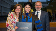 Alexandra Paige Moorehead, Ph.D., and her family celebrate her graduation.