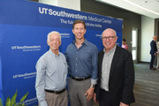 Former patients John Pomara and Frank Santoro (left) lead the ribbon cutting of the new West Campus Building 3 at a July 25 dedication ceremony.