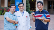 Joonho Yoon, Ph.D., (center) enjoys the reception with friends.