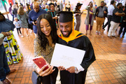 Christopher Perkins, master of physician assistant studies, celebrates with loved one Cennedy Perkins.