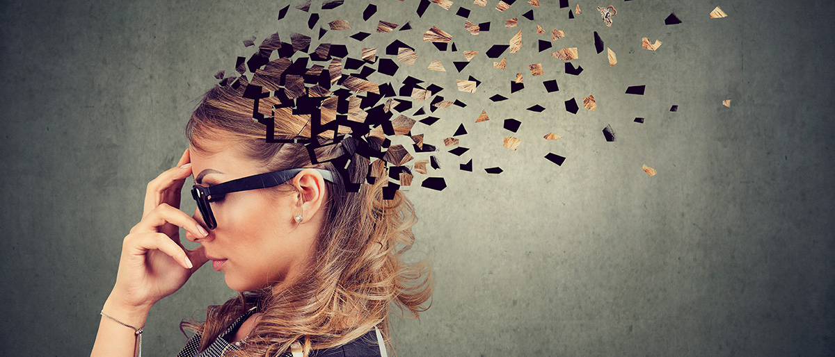 Abstract photo of woman with glasses losing parts of her mind