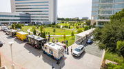 The sky was clear and sunny as UTSW community members line up to order lunch at the trucks parked along the green space behind Professional Office Buildings 1 & 2 on West Campus.