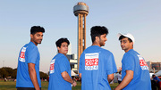 Reunion Tower makes a good backdrop for these four walkers.