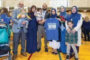 Nida Ahmed is surrounded by her family as they celebrate her Match.