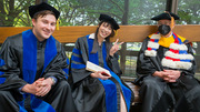 From left: Zane Johnson and Wen-Chuan Hsieh wait for the procession to begin with Nobel Laureate Michael Brown, M.D., Professor of Molecular Genetics and Internal Medicine.