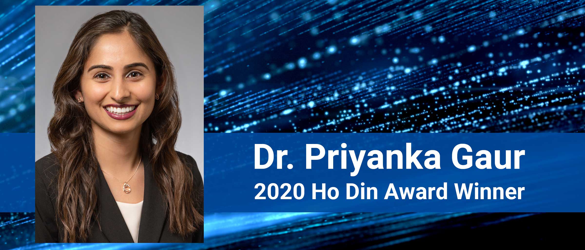 Woman in suit smiling, Dr Priyanka Gaur 2020 Ho Din Award Winner