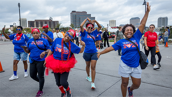 Walkers in the 2025 Heart Walk dancing for the camera.year-in-review-gallery-2025-primary-690x338.jpg