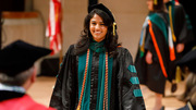 Dr. Esha Hansoti proudly completes her walk across the stage to receive her diploma.