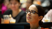 An audience member listens intently to the program.