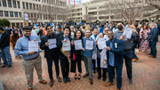Several fourth-year medical students proudly hold up their match letters.
