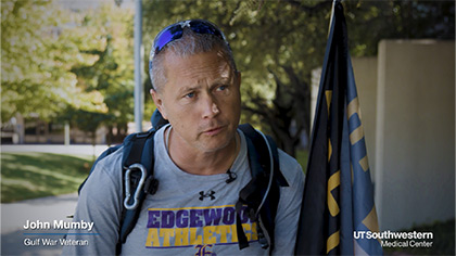 man walking with flag