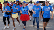 A band of walkers spots the camera as they get started on the walk.