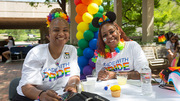 Brunch: At the brunch, UTSW employees Angel Steed (left) and Leona White wear colorful flower necklaces to show their support.