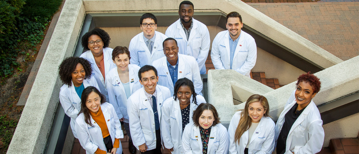 Group of young people in lab coats