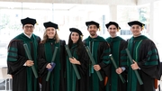 New graduates posing for a photo with their diplomas include (from left) Zapata Nunez, M.D., Lauren Ford, M.D., Amanda Galvan, M.D., Daniel Galvan, M.D., Scott Crawford, M.D., and Mauricio Valdez, M.D.