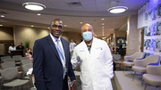 Rawle Philbert, D.D.S., Associate Professor of Surgery and Division Chief of Oral and Maxillofacial Surgery, (left) pauses for a photo with Quinn Capers IV, M.D., Associate Dean for Faculty Diversity, Vice Chair for Diversity and Inclusion, and Professor of Internal Medicine.