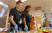 School of Health Profession students Rayna Jeter (left) and Jamala Christopher offered tips and nutritious dishes, including turkey lettuce tacos, Mexican street corn salad, and skinny tres leches.