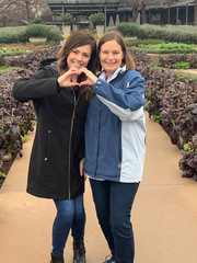Amanda Weckman (left) and Kathleen Wanhanen pose at the Dallas Arboretum and Botanical Garden where Sponsored Programs Administration held its annual retreat.