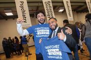 (Left to right) Trey Cinclair and Ali Khurram celebrate their matches with their blue shirts.