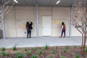 Caitlin Jarred and Tasha Champagne, students in the School of Health Professions, pictured here using chalk and keeping the proper physical distance.