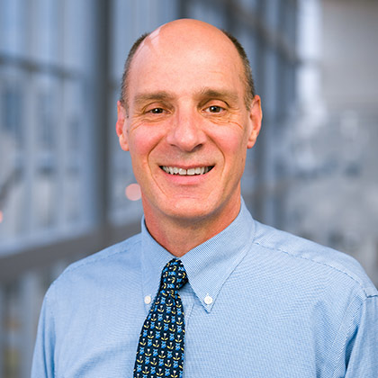 Man in blue shirt and tie