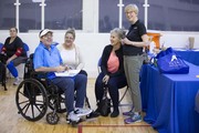 Dr. Kathleen Bell, an athlete, and family share a laugh