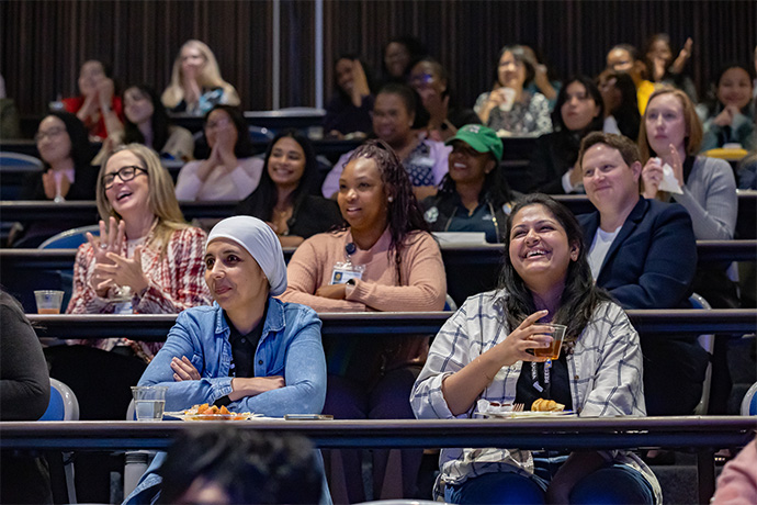 auditorium audience of smiling women