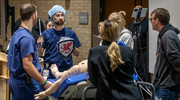 On May 8, UT Southwestern emergency medicine residents joined peers from area hospitals to compete in the Romeo and Juliet-themed North Texas Regional Sono/Simwars, a competition designed to test residents’ technical knowledge and clinical skills. Above, Samuel Parnell, M.D., Assistant Professor of Emergency Medicine at UTSW, played his part, helping guide a team to treat a simulated patient.
