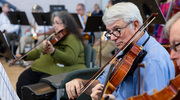 Pediatric nephrologist Dr. Quigley, playing his viola at the practice, has soothed babies in the NICU of Parkland Memorial Hospital with sweet melodies.