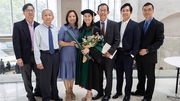 Bonnie Leung, M.D., with her family, is all smiles after she receives her diploma.