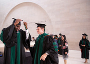 Dr. Patrick Roberts (left) and Dr. James Mawalaniec (right) do a final regalia check before heading backstage.